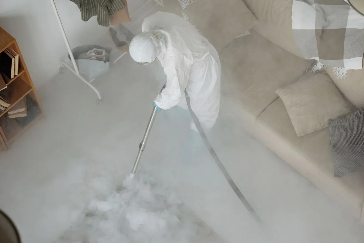 Biohazard cleanup technician in protective equipment, Marshfield, MO